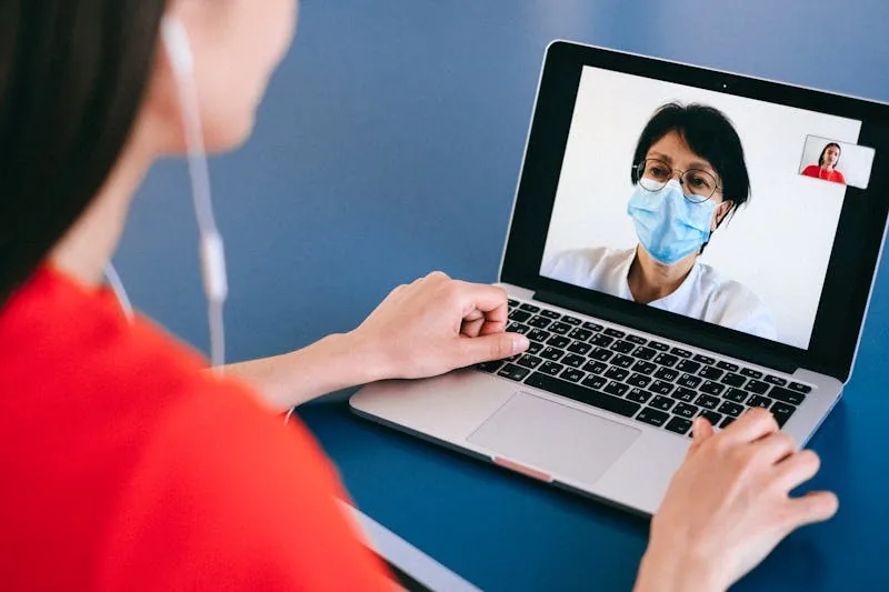 Patient in a video visit with a primary care provider on a tablet