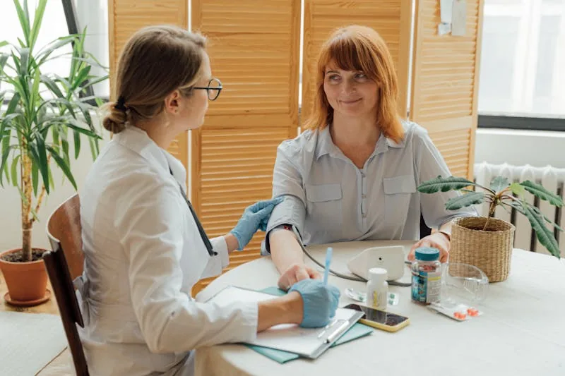 Doctor checking patient blood pressure