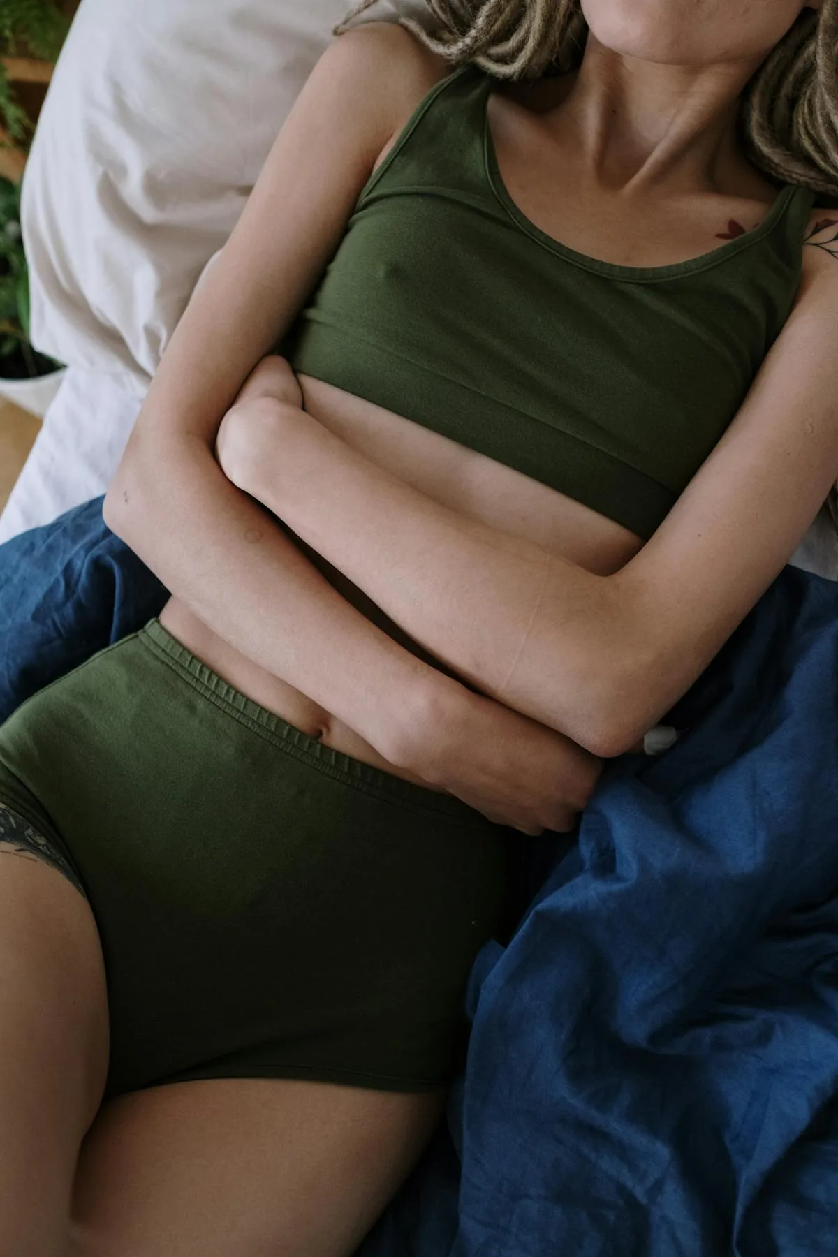 Person with stomach discomfort — digestive health evaluation