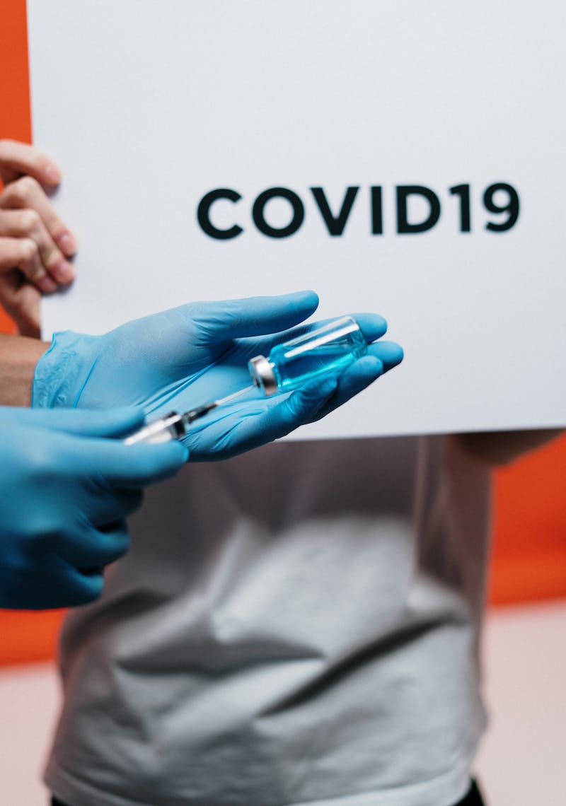 COVID test kit and face mask — when to get tested