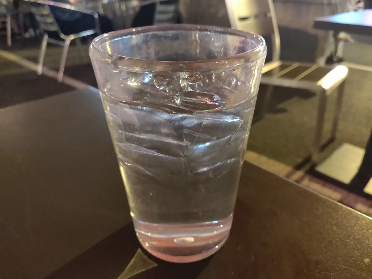 A glass of water on a table