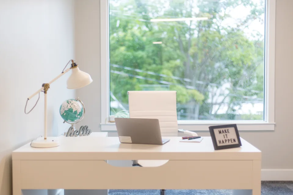 Laptop on a tidy home desk for an online doctor visit