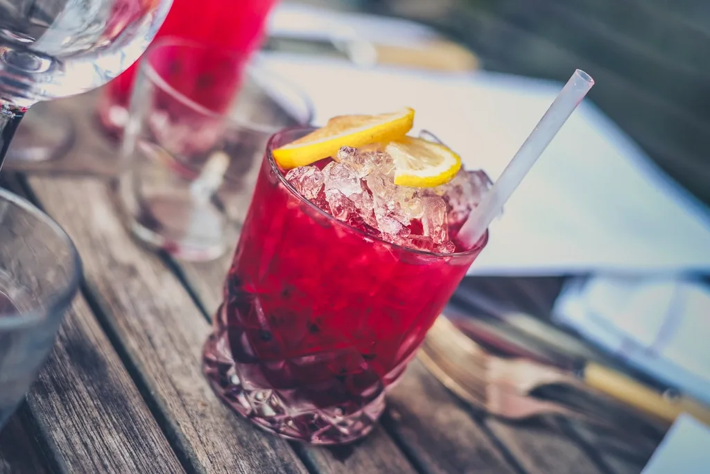 Glass of cranberry juice over ice for comfort and hydration while waiting for antibiotics
