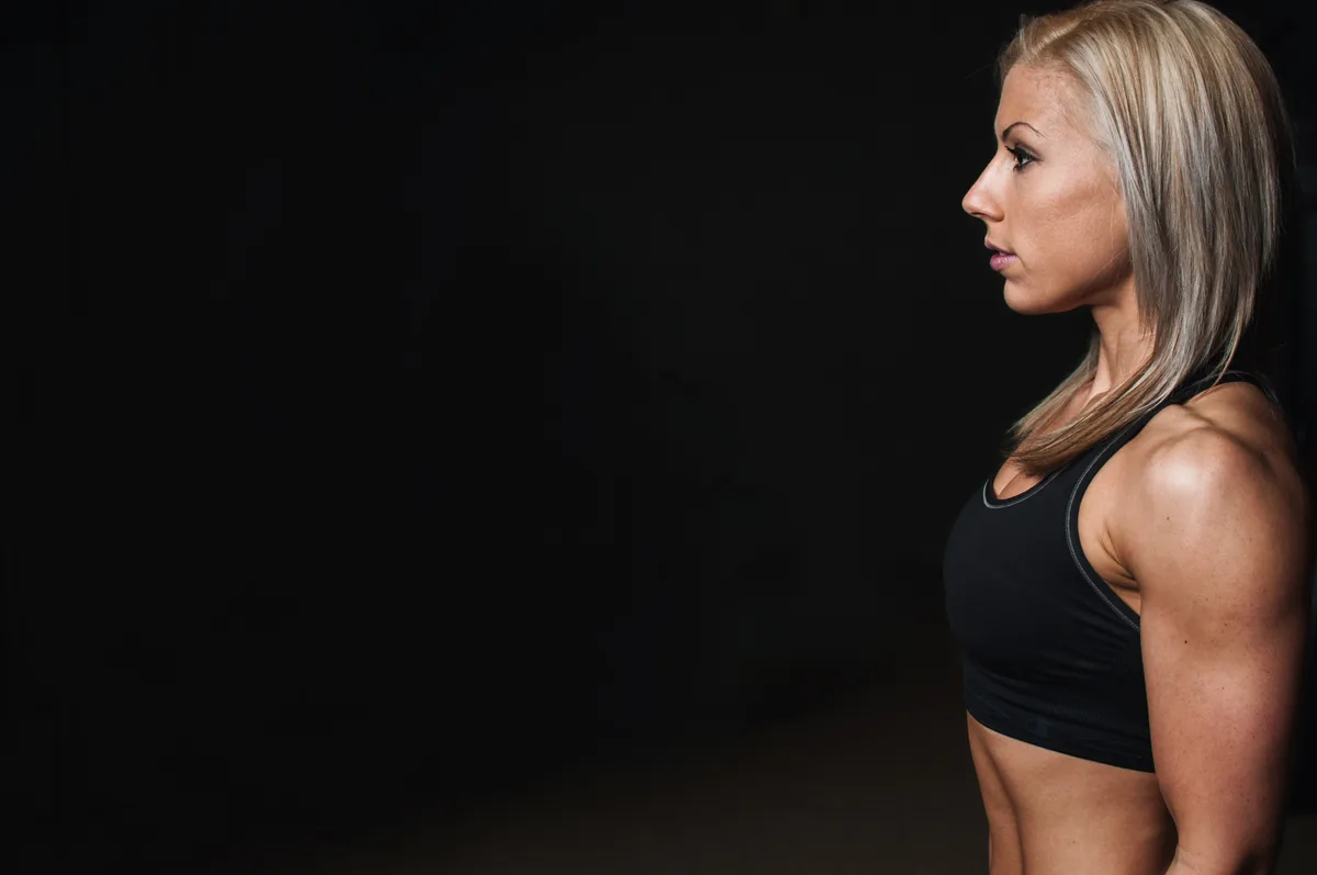 Athletic woman in workout clothing representing jock itch risk in active people