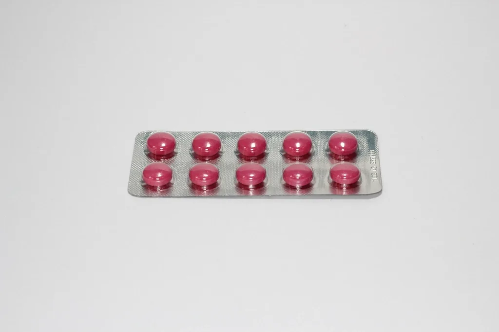 A blister pack of medication tablets, representing an antibiotic prescription for STI treatment