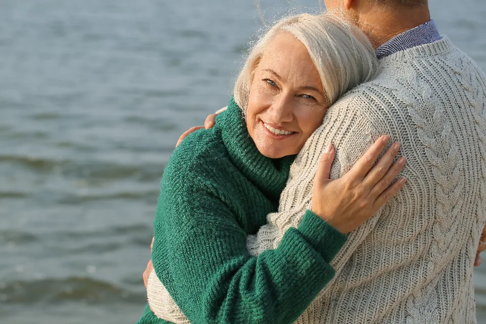 Older couple embracing, representing the age group most at risk for shingles